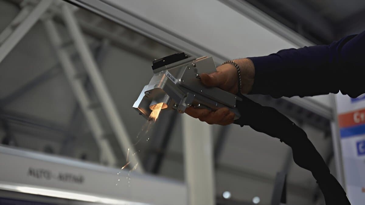 Handheld laser cleaning head in use